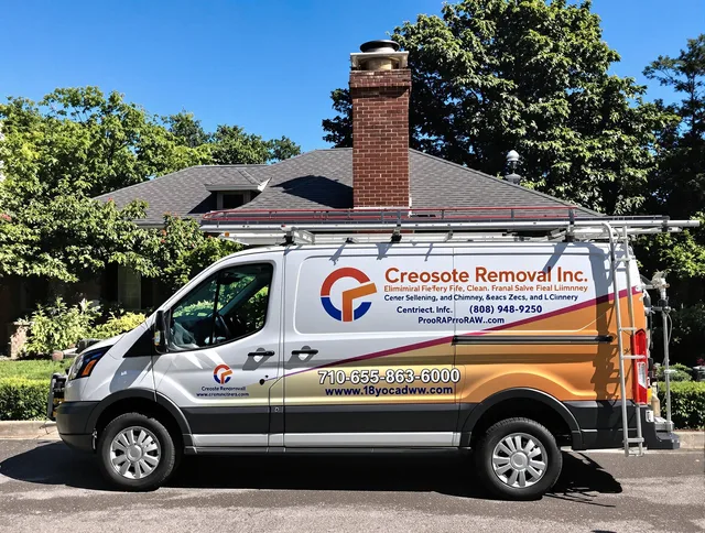 Cimarron Hills Chimney Sweep technician removing creosote safely in Cimarron Hills, CO