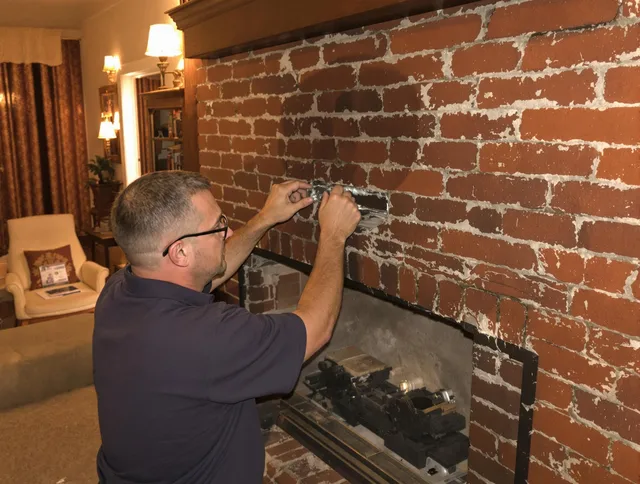 Cimarron Hills Chimney Sweep expert fixing a fireplace in Cimarron Hills, CO
